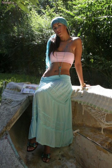 Latin chick Isobel Riveira lifting her long skirt up demonstrating hot slit and nasty posing outdoor.