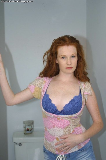 Red-haired Ivy Manner shows her shaved pink snatch after losing her blue lingerie in the bathroom