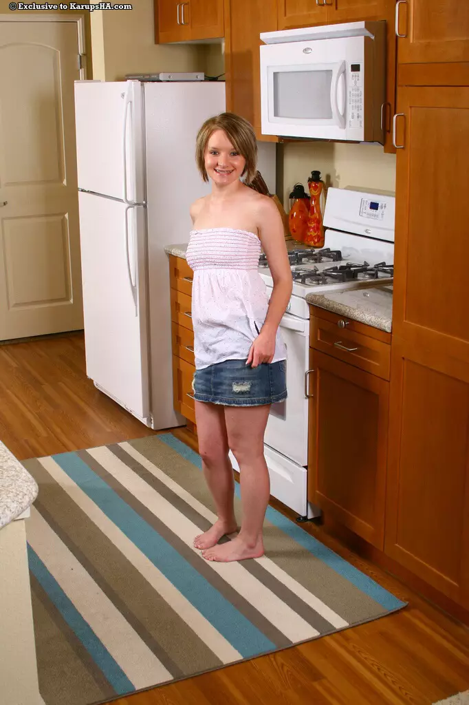 Playful Faith Daniels shows it all after she gets naked in the middle of the kitchen