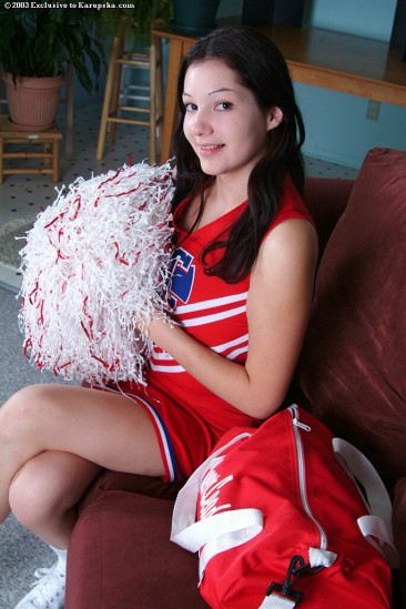 Alluring kitty Kathleen Kruz in red cheerleader uniform takes off her panties and shows her twat