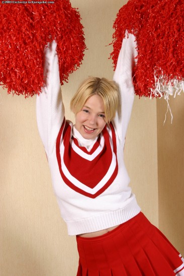 Playful uniformed cheerleader Missy Monroe can