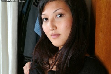 Asian kitty Sable Simms removes her blue jeans to give a close-up of her hairy snatch