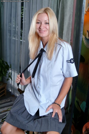 Blond cutie in uniform Sarah Sinn bares her tits and then exposes her clean pussy