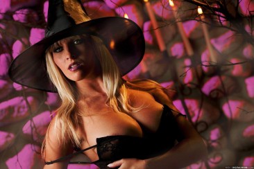 European blonde Cikita in black hat shows off her breathtaking huge boobs