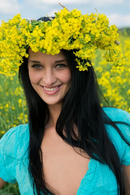 The nude brunette teen Katya AC looks like the meadow queen posing among the flowers