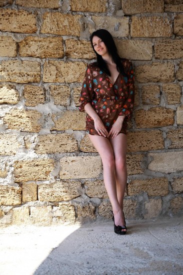 The brunette teen Nichole A has found a quiet place and stripped posing naked against the wall