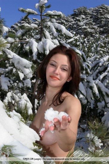 The big titted chick Ornella Femjoy performs the hot softcore posing in the snow
