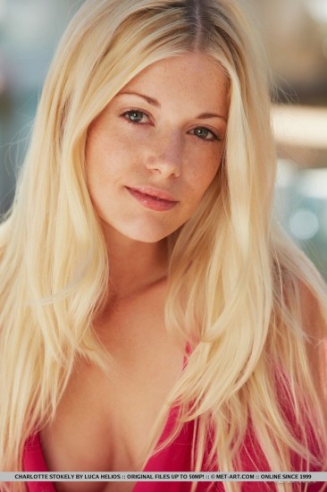 Charlotte Stokely is a blonde darling who loves to pose outdoor on sunny days.
