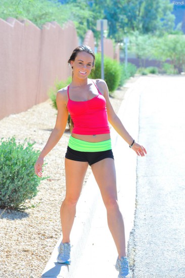 Sporty brunette babe Rahyndee James strips outdoors and teases in the middle of the road