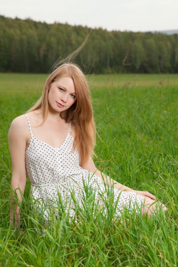 Fooling around in the green meadow this cutie Anett A is exposing both shaved clefts