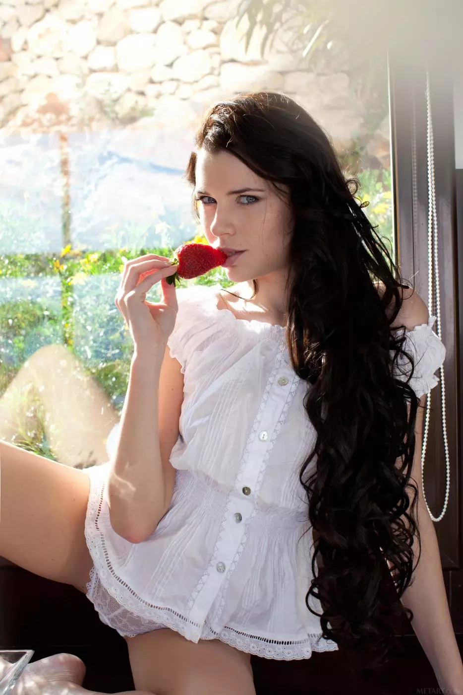 Baring her sexy white clothes hot brunette Valeria A poses and eats strawberries