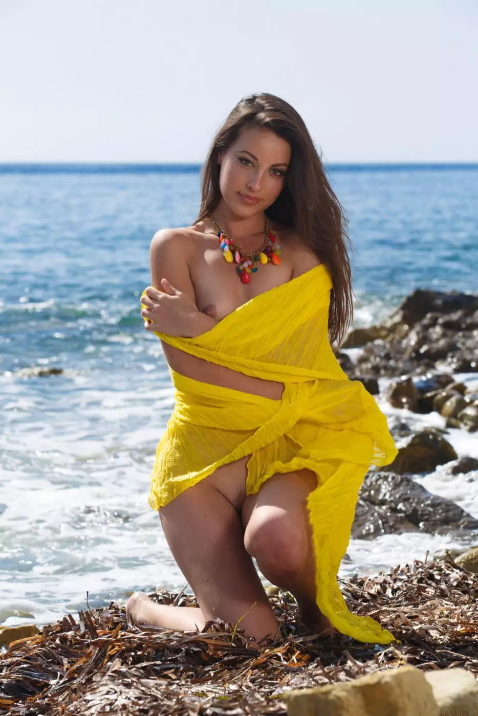 Latina cutie Lorena Morena is under the sea sun exposing her nice hairy pussy lips