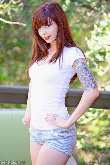 Sweet girl with red hair Ivy Jean strips out of her cute outfit outdoors and poses