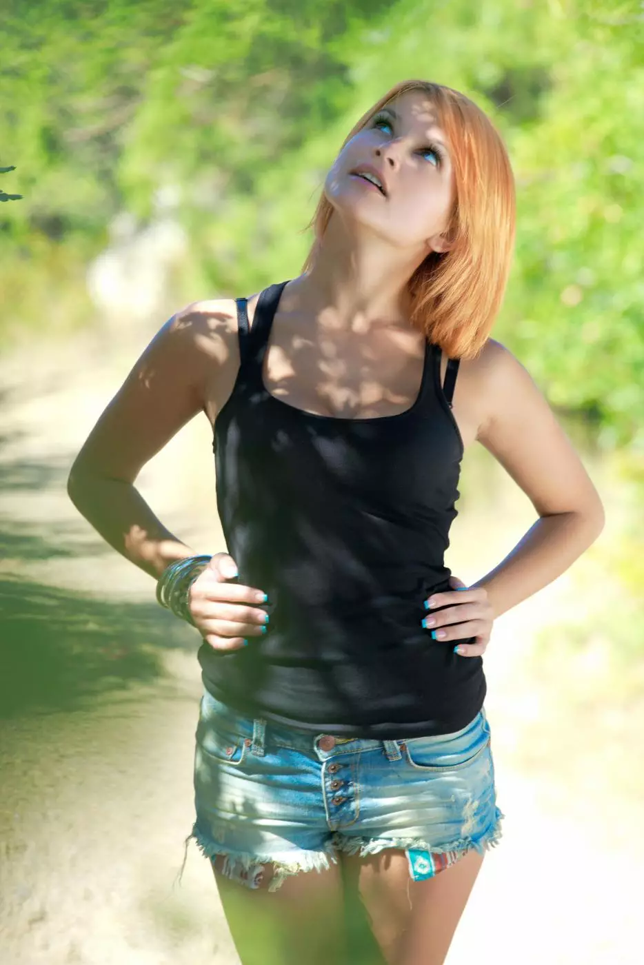 Softcore scenes with redhead chick Violla A stripping under the green trees