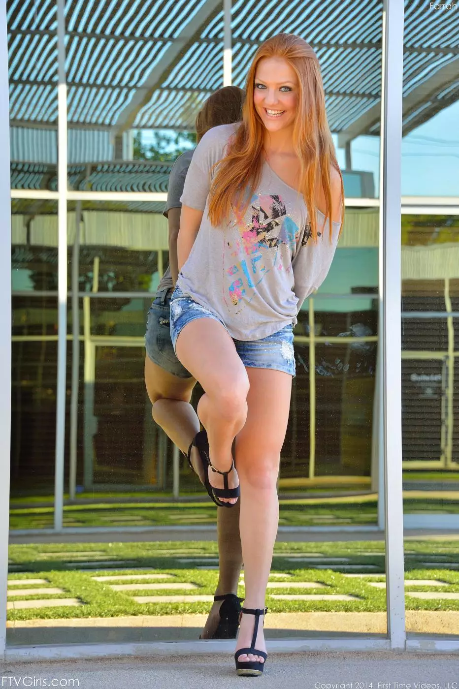 Teen redhead hottie Farrah Flower removes her clothes in the park and teases