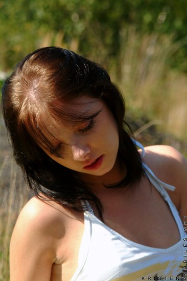 Kristen Nubiles becomes one with nature doing some softcore posing in outdoor scenery.