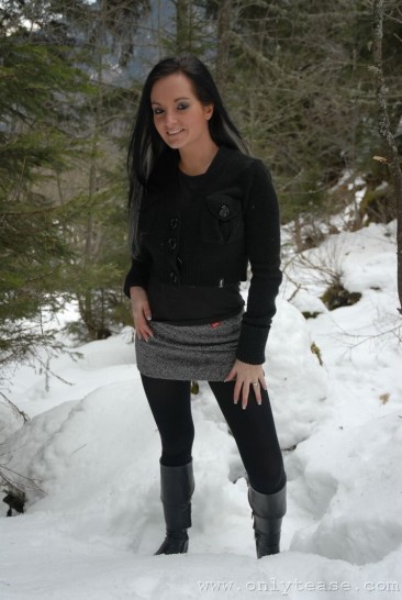 Very brave brunette Kate B in tight black pantyhose poses topless in winter