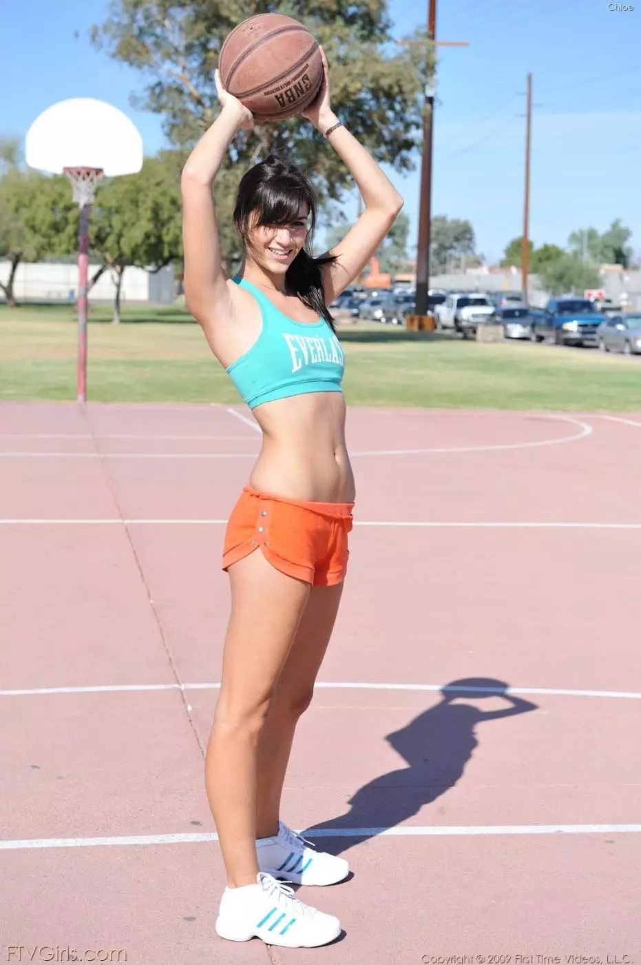 After playing basket-ball bratty brunette Chloe makes a stripshow on the field
