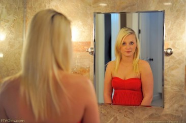 Fair haired teen Whitney FTV in red dress fucks her pussy with her hairbrush beside the mirror
