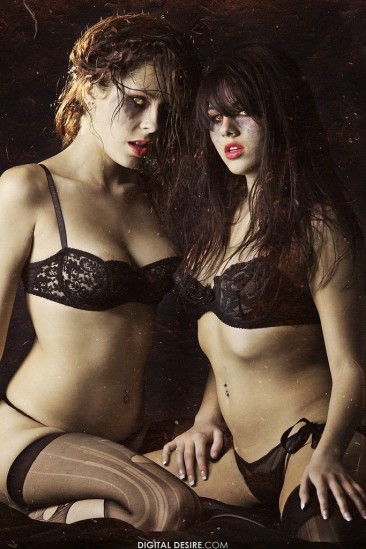 Nikki Brooks and her lez friend both with ugly make-up and in black lingerie make love in the dark.