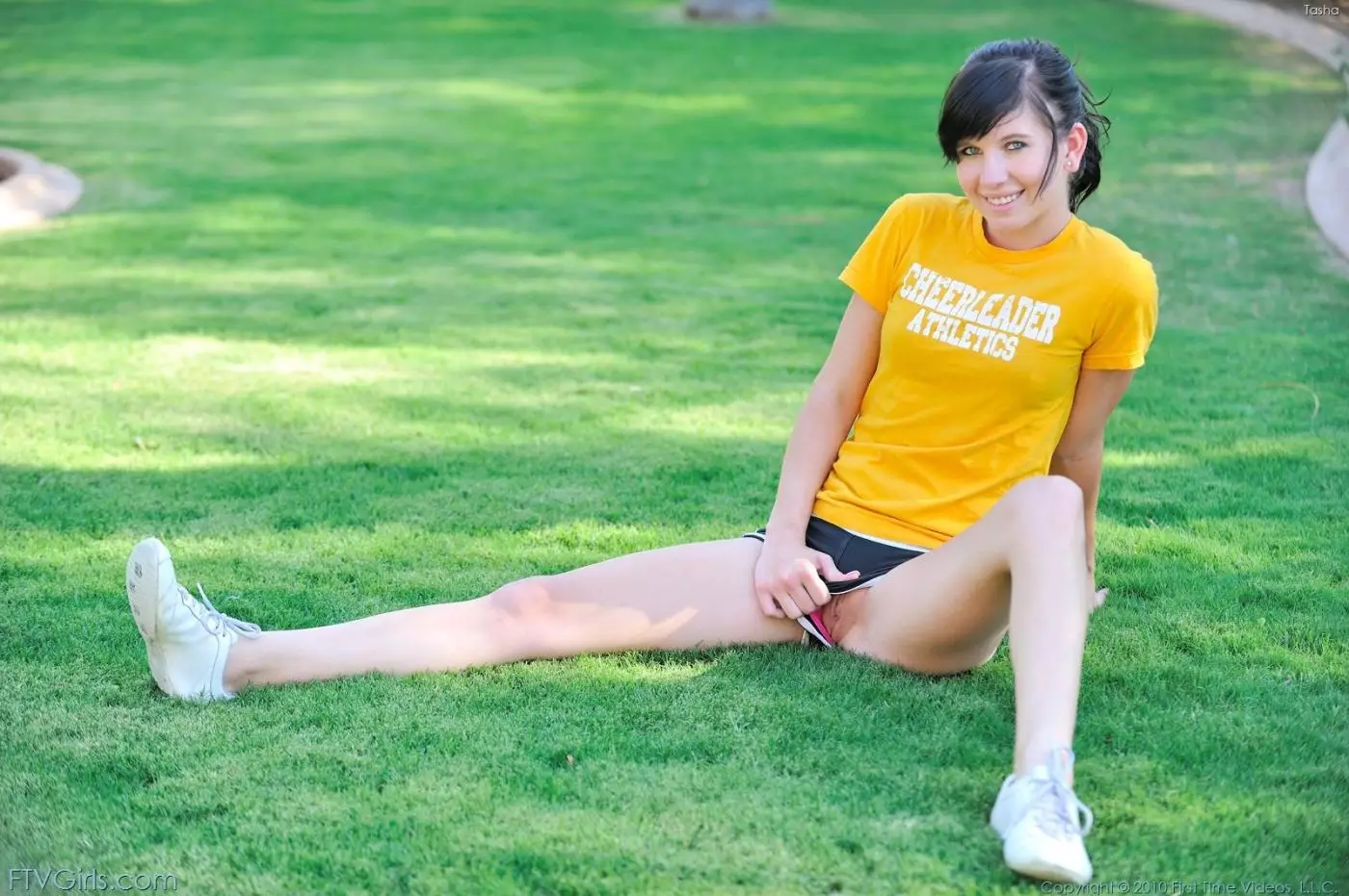 Teen Tasha FTV removes her shorts and panties then does stretching exercises outdoors