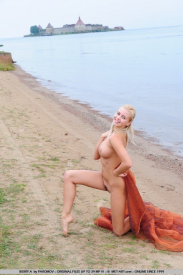 Panicky blonde Berry A seduces with her hot nude body wrapped in a shawl on the river bank