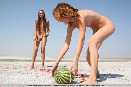 Two naked slender sweeties Itna A and Freya A eat watermelon on the beach