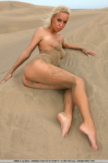 Fine looking nude blonde Natali Blond with sexy legs and tight ass poses in sand