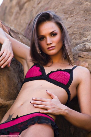 Petite beauty Tori Black in sexy high heel shoes takes off her lingerie on a rock